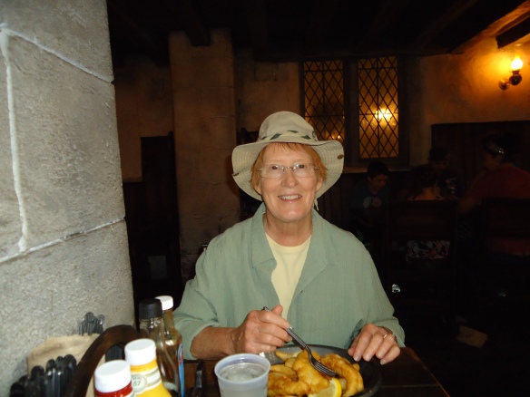 Peggy eating  fish and chips at the Leaky Cauldron.